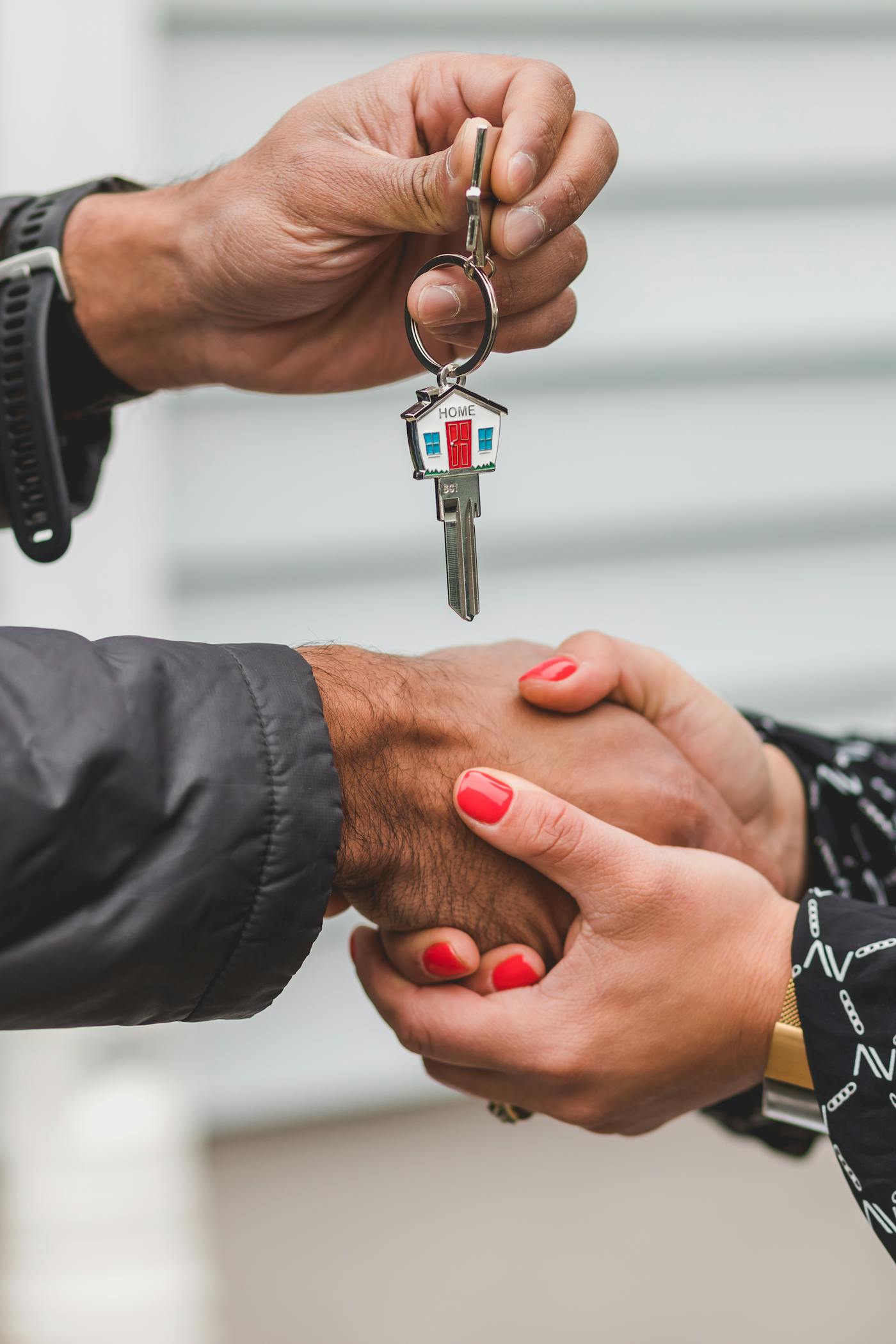 Keys being handed over after a closing.